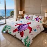 Bed with red sea turtle-themed bedding in a room with ocean view